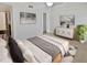 Spacious bedroom with a cozy bed, dresser, and plenty of closet space at 705 S Village N Dr # 205, St Petersburg, FL 33716