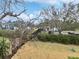 View of community landscape with green grass and trees at 705 S Village N Dr # 205, St Petersburg, FL 33716