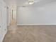 Bright hallway with tile floors and access to bedrooms at 705 S Village N Dr # 205, St Petersburg, FL 33716