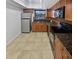 Kitchen with granite countertops and stainless steel appliances at 705 S Village N Dr # 205, St Petersburg, FL 33716