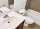 Clean bathroom with single vanity, toilet and bathtub at 407 Stone Briar Dr, Ruskin, FL 33570