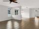 Bright living room with tile floors and a view into the kitchen at 407 Stone Briar Dr, Ruskin, FL 33570