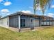 Spacious screened patio extending from the back of the house at 407 Stone Briar Dr, Ruskin, FL 33570