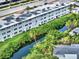 Aerial view of condo building next to canal at 4455 Duhme Rd # 205, St Petersburg, FL 33708