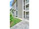 Condo building exterior showcasing landscaping and architectural details at 4455 Duhme Rd # 205, St Petersburg, FL 33708