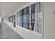 Condo hallway with windows offering natural light and views at 4455 Duhme Rd # 205, St Petersburg, FL 33708