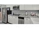 Stainless steel appliances and white shaker cabinets at 4455 Duhme Rd # 205, St Petersburg, FL 33708