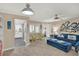 Spacious living room featuring a blue couch and coastal decor at 4455 Duhme Rd # 205, St Petersburg, FL 33708