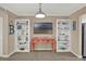 Living area with built-in shelving and coastal decor at 4455 Duhme Rd # 205, St Petersburg, FL 33708