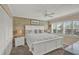 King-size bed in spacious main bedroom with white accents at 4455 Duhme Rd # 205, St Petersburg, FL 33708