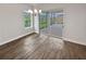 Bright dining room with hardwood floors and access to a patio at 4739 Butler National Dr, Wesley Chapel, FL 33543