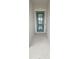 Front entry with teal door and light-colored flooring at 4739 Butler National Dr, Wesley Chapel, FL 33543