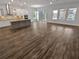 Open living area showcasing wood-look floors at 4739 Butler National Dr, Wesley Chapel, FL 33543