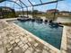 Relaxing screened-in pool with spillover spa at 4739 Butler National Dr, Wesley Chapel, FL 33543