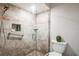 Walk-in shower with glass enclosure and tiled walls at 5711 Avista Dr # 4110, Sarasota, FL 34243