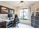 Home office with built-in shelving and plenty of natural light at 5711 Avista Dr # 4110, Sarasota, FL 34243