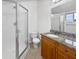 Bathroom with granite countertop and shower at 9416 Citrus Glen Pl, Tampa, FL 33618