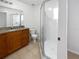 Bathroom with granite countertop and shower at 9416 Citrus Glen Pl, Tampa, FL 33618