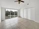 Main bedroom with large windows, ceiling fan and walk-in closet at 9416 Citrus Glen Pl, Tampa, FL 33618