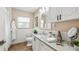 Clean bathroom with granite countertop, white cabinets, and a shower/tub combo at 105 17Th Ne Ave, St Petersburg, FL 33704