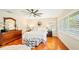 Bedroom with hardwood floors, a ceiling fan, and plenty of light at 105 17Th Ne Ave, St Petersburg, FL 33704