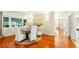 Bright dining room with hardwood floors and a charming table setting at 105 17Th Ne Ave, St Petersburg, FL 33704