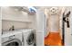 Laundry room with washer, dryer, and additional shelving at 105 17Th Ne Ave, St Petersburg, FL 33704