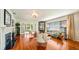 Spacious living room featuring hardwood floors, fireplace, and ample natural light at 105 17Th Ne Ave, St Petersburg, FL 33704