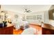 Spacious main bedroom with hardwood floors and a ceiling fan at 105 17Th Ne Ave, St Petersburg, FL 33704