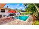Inviting rectangular pool with brick patio and lounge chairs at 105 17Th Ne Ave, St Petersburg, FL 33704