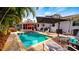 Inviting rectangular pool with brick patio and lounge chairs at 105 17Th Ne Ave, St Petersburg, FL 33704