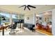 Bright sunroom with workspace, brick feature wall, and view of backyard at 105 17Th Ne Ave, St Petersburg, FL 33704