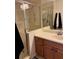 Bathroom with shower, vanity, and linen storage at 915 Fairwaycove Ln # 206, Bradenton, FL 34212