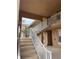 Interior stairwell with white railings leading to upper levels at 915 Fairwaycove Ln # 206, Bradenton, FL 34212