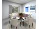 Dining room featuring a round wooden table and six chairs at 1832 Draughton Dr, Zephyrhills, FL 33541