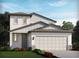 Two-story home with gray and white siding, a two-car garage, and landscaping at 1868 Brekey Way, Zephyrhills, FL 33541