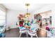 Bright dining area with white wicker chairs at 2101 Sunset Point Rd # 2304, Clearwater, FL 33765