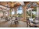 Bright dining area with large windows overlooking a golf course at 6720 The Masters Ave, Lakewood Ranch, FL 34202