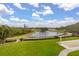 Picturesque golf course with pond and fountain at 6720 The Masters Ave, Lakewood Ranch, FL 34202