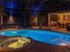 Night view of a relaxing pool and spa with ambient lighting at 6720 The Masters Ave, Lakewood Ranch, FL 34202