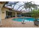 Relaxing pool and spa area with covered patio and lush landscaping at 6720 The Masters Ave, Lakewood Ranch, FL 34202