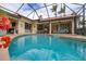 Inviting screened pool and spa with plenty of patio space for relaxing at 6720 The Masters Ave, Lakewood Ranch, FL 34202