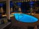 Lighted pool and spa at night, creating a relaxing atmosphere at 6720 The Masters Ave, Lakewood Ranch, FL 34202