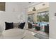 Relaxing seating area with sliding glass doors opening to a view of the pool at 6720 The Masters Ave, Lakewood Ranch, FL 34202