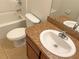 Clean bathroom with a single sink vanity and bathtub at 562 Vista Ridge Dr, Ruskin, FL 33570