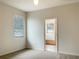 Bedroom with bathroom access and neutral decor at 562 Vista Ridge Dr, Ruskin, FL 33570
