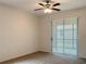 Bedroom with sliding door to a screened patio at 562 Vista Ridge Dr, Ruskin, FL 33570