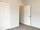 Bright bedroom with double door closet and access to hallway at 562 Vista Ridge Dr, Ruskin, FL 33570