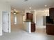Open kitchen with breakfast bar and access to living areas at 562 Vista Ridge Dr, Ruskin, FL 33570