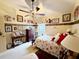 Cozy bedroom with floral bedding and ceiling fan at 5465 Chestnut Ridge Rd, Dade City, FL 33523